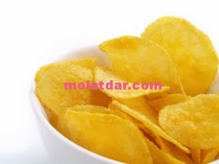 Yummy potato chips in white bowl