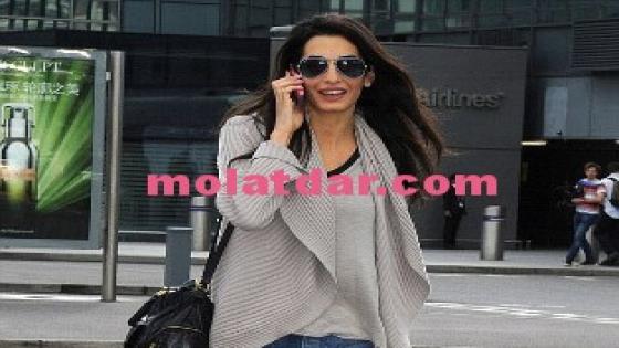 صور خطيبة جورج كلوني تثير السخرية بحذاء رجالي وبنطلون ممزق